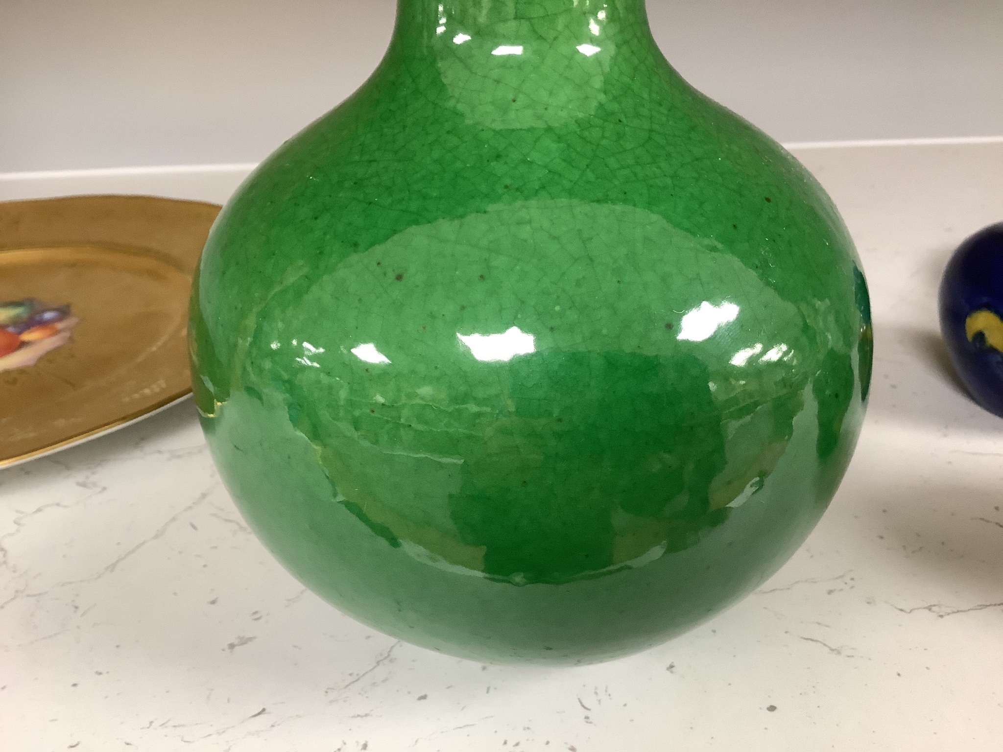 A Chinese green crackle glaze monochrome bottle vase, 24 cm high